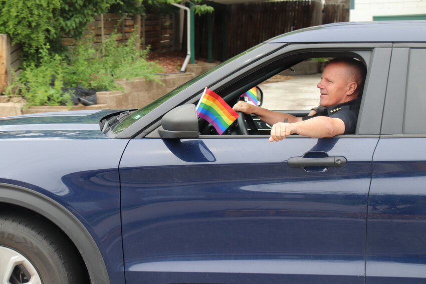 Edgewater's Police Chief Eric S. Sonstegard rode in the parade. His car was adorned with Pride flags.